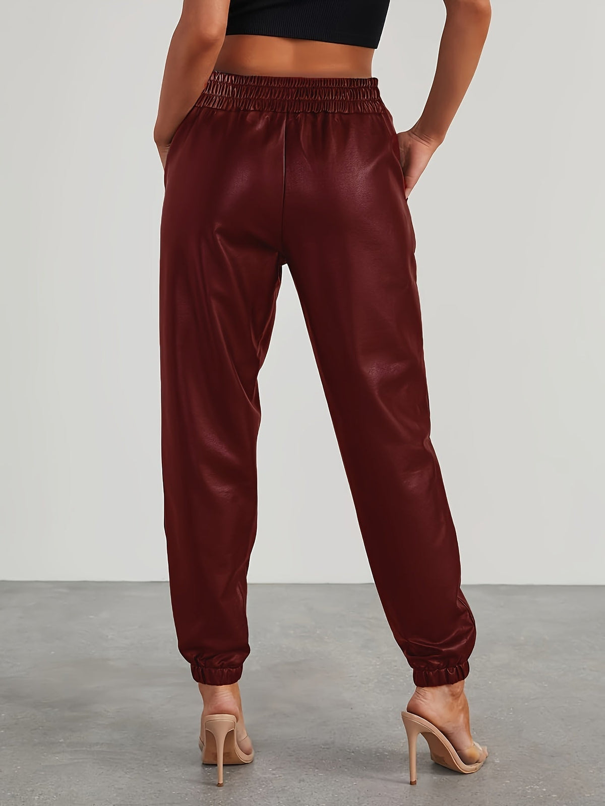 Pantalon aspect cuir à taille et chevilles élastiquées — Amielle Paris