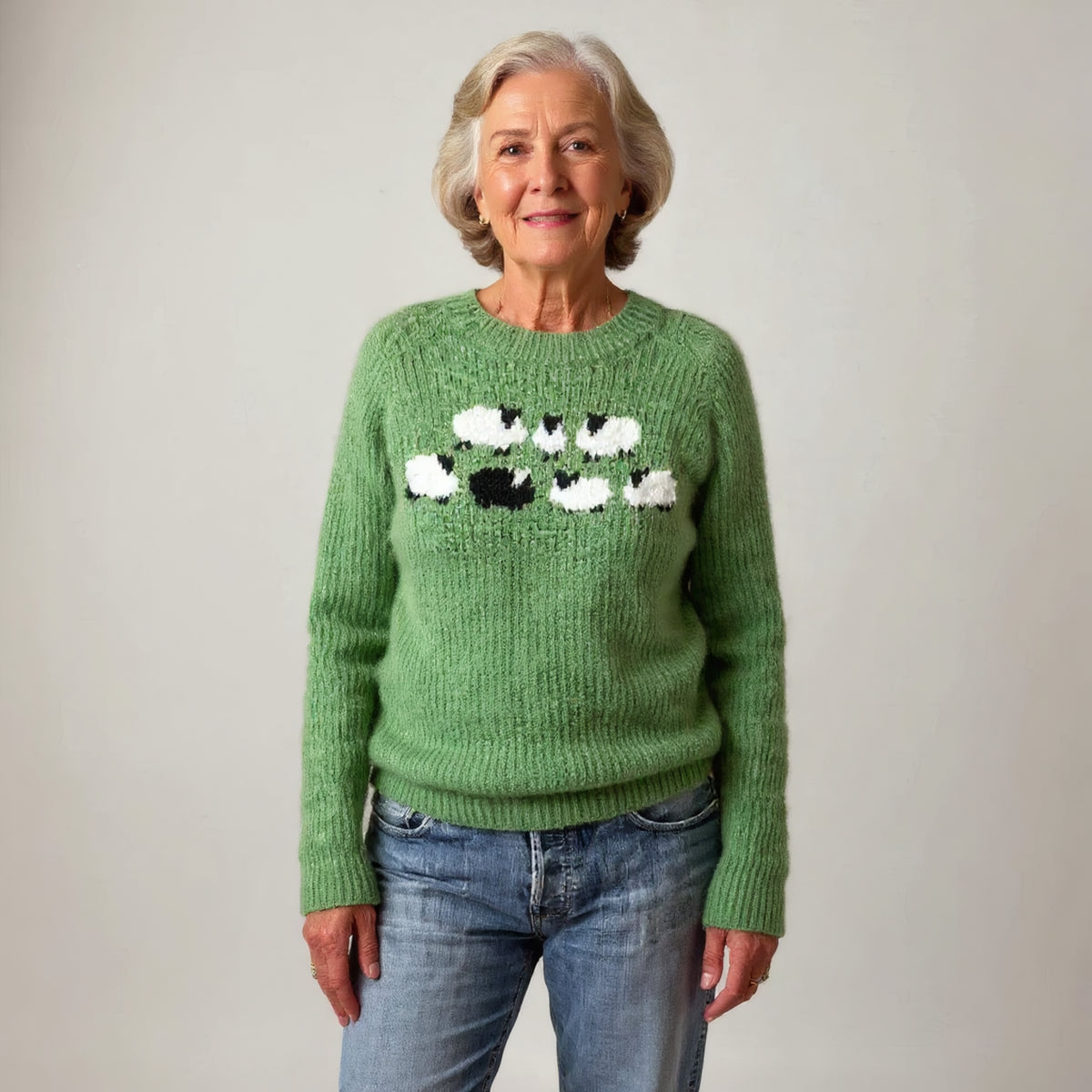 Pull vert à motif moutons