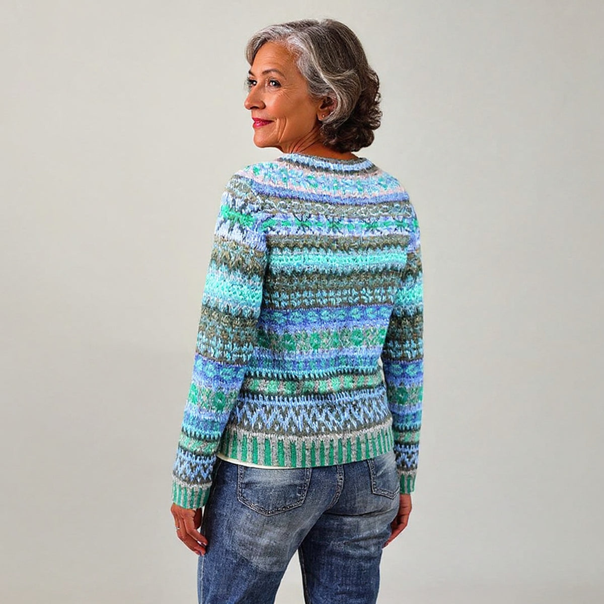 Pull bleu et vert à motifs géométriques