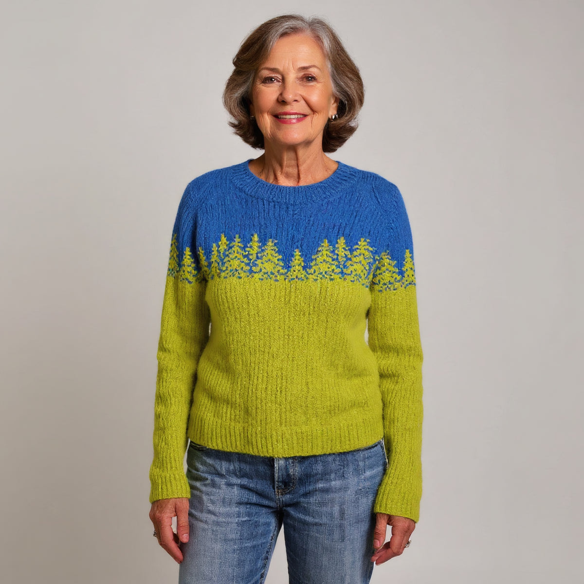 Pull bicolore bleu et vert à motif sapins