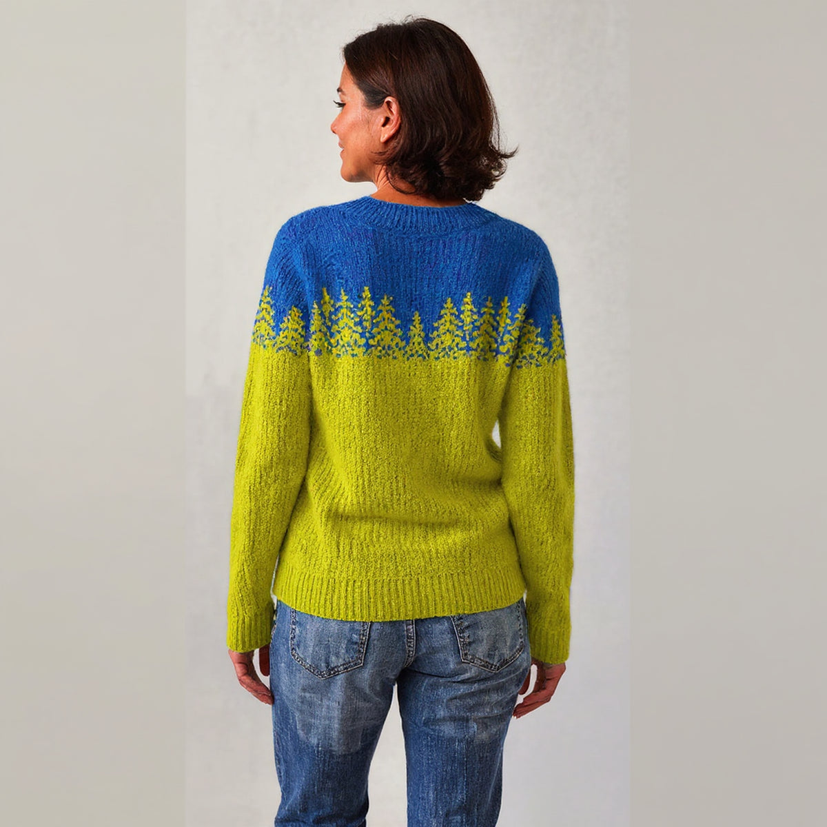 Pull bicolore bleu et vert à motif sapins