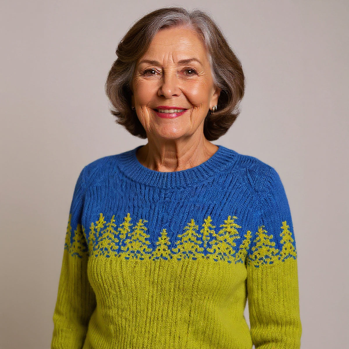 Pull bicolore bleu et vert à motif sapins