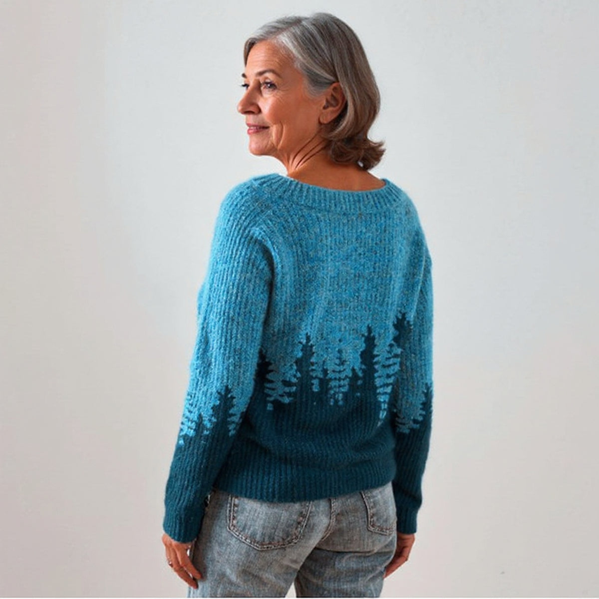 Pull bleu à motif forêt