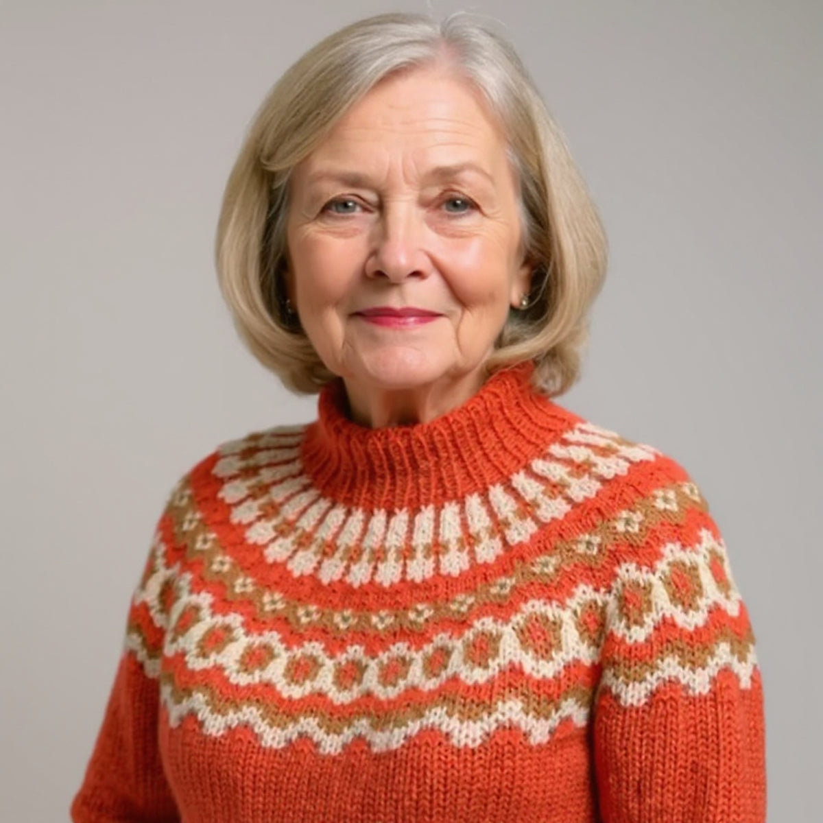 Pull orange à col montant et motifs nordiques