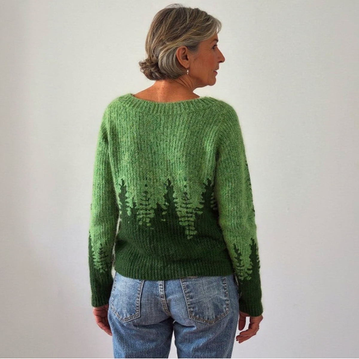 Pull vert à motif forêt