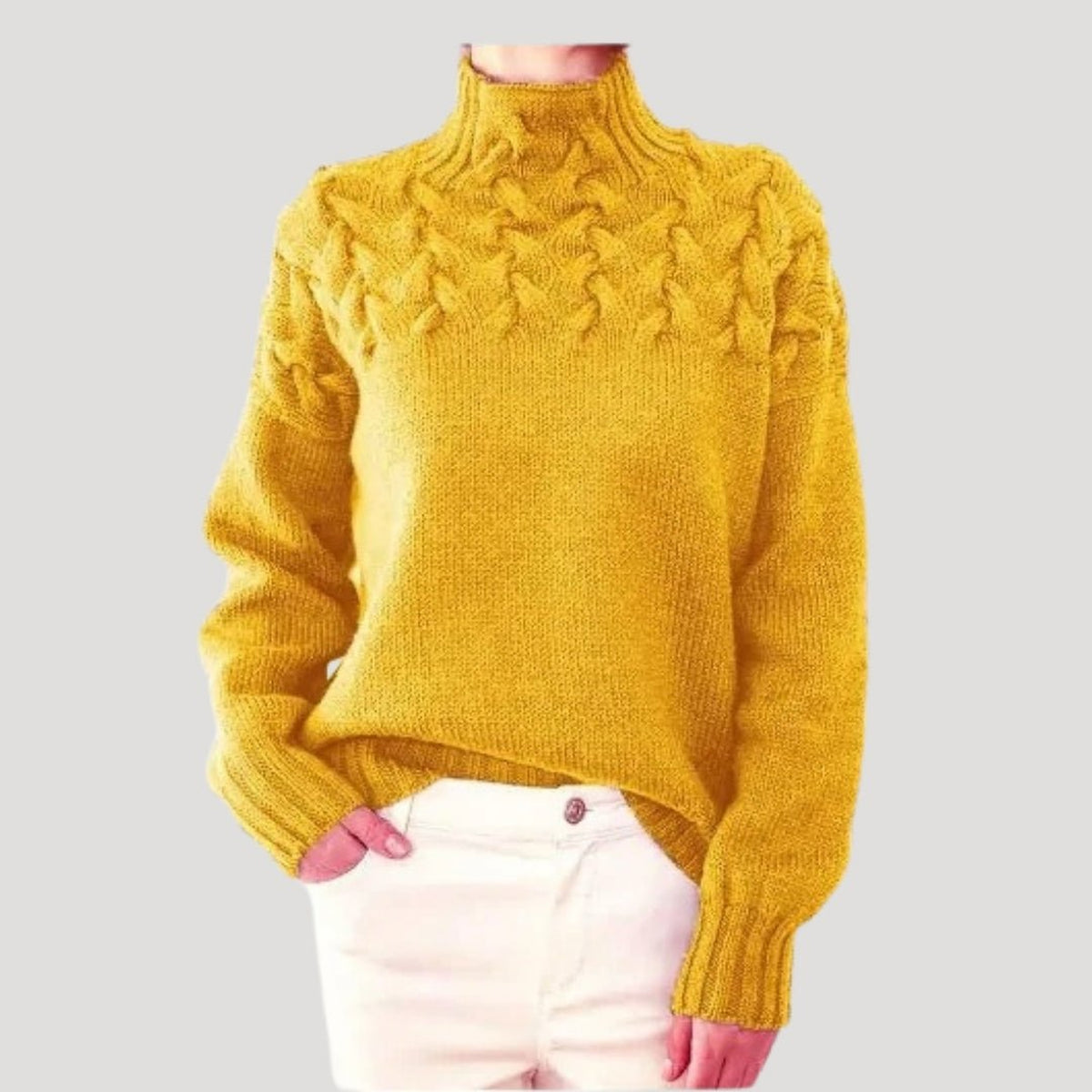 Pull en maille torsadée à col montant