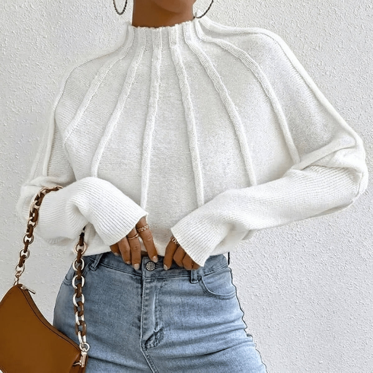 Pull à col montant et détails côtelés