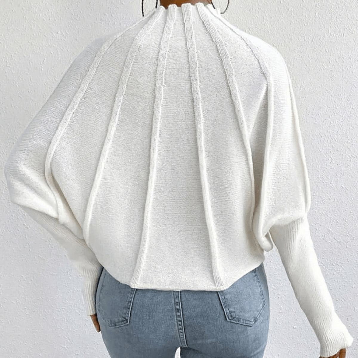 Pull à col montant et détails côtelés