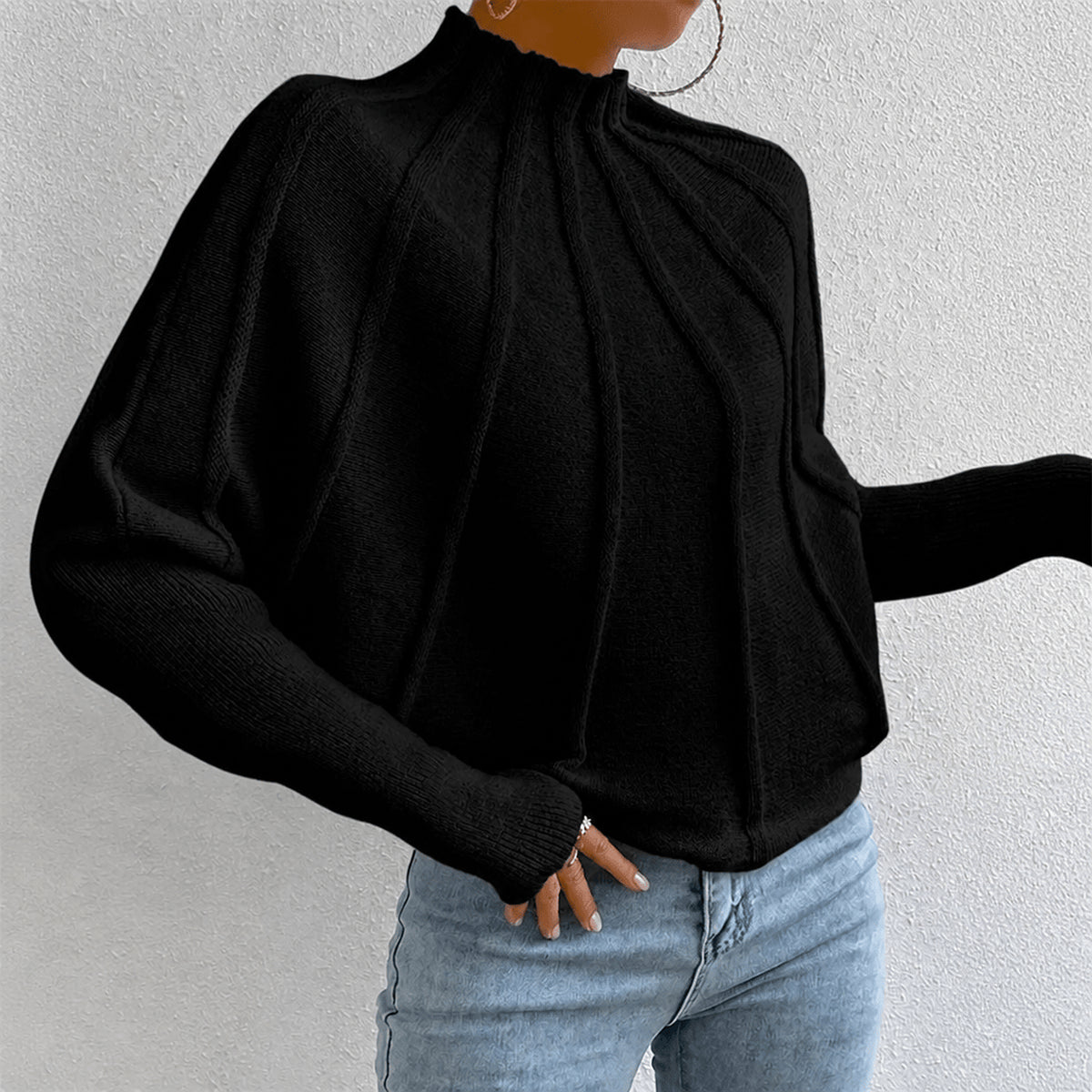 Pull à col montant et détails côtelés