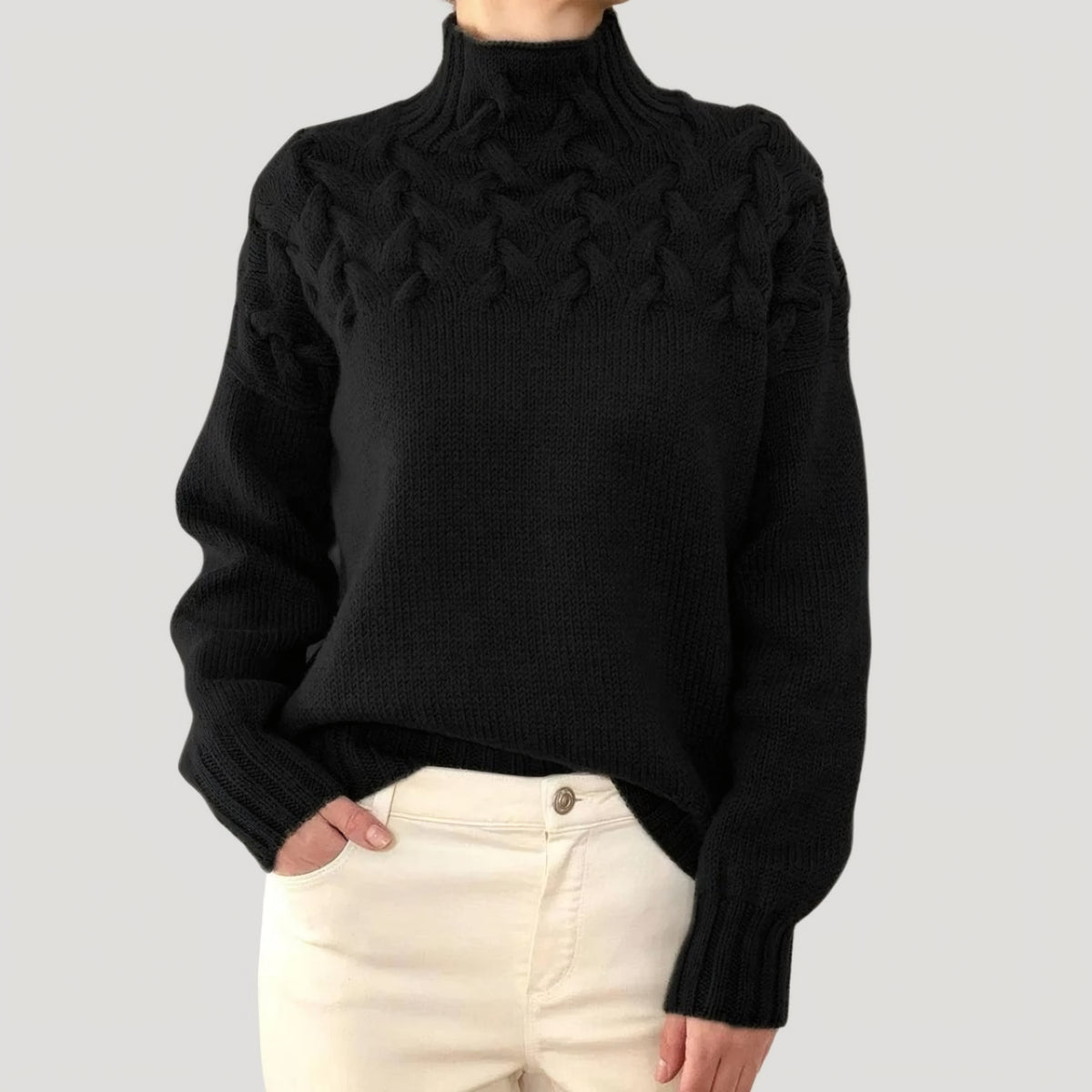 Pull en maille torsadée à col montant
