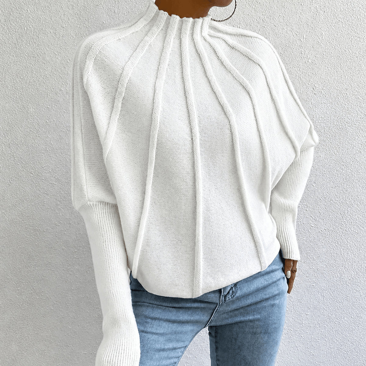 Pull à col montant et détails côtelés