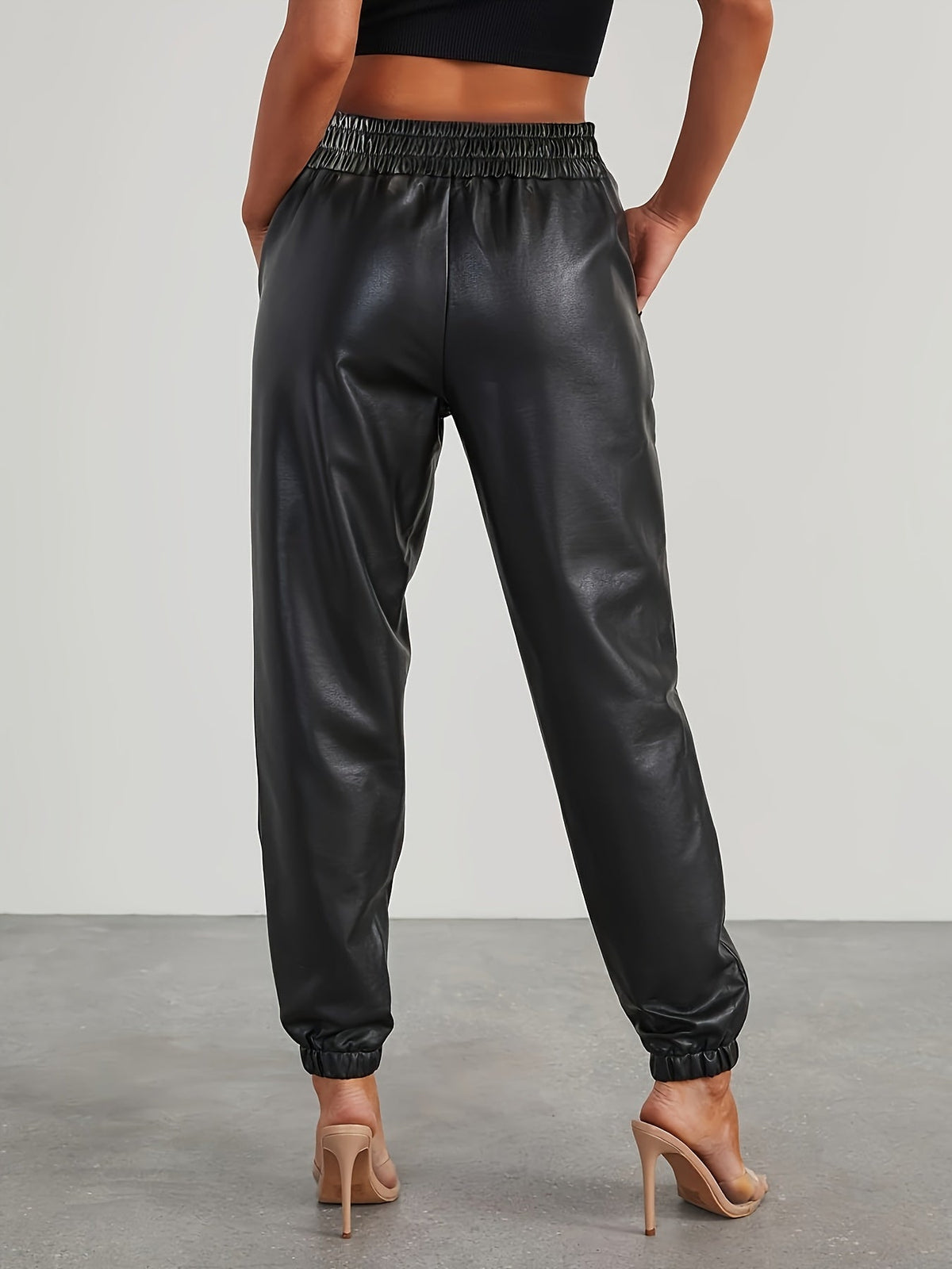 Pantalon aspect cuir à taille et chevilles élastiquées — Amielle Paris