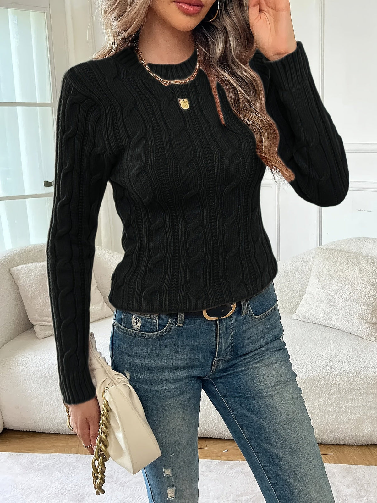 Pull noir torsadé à col rond — Amielle Paris