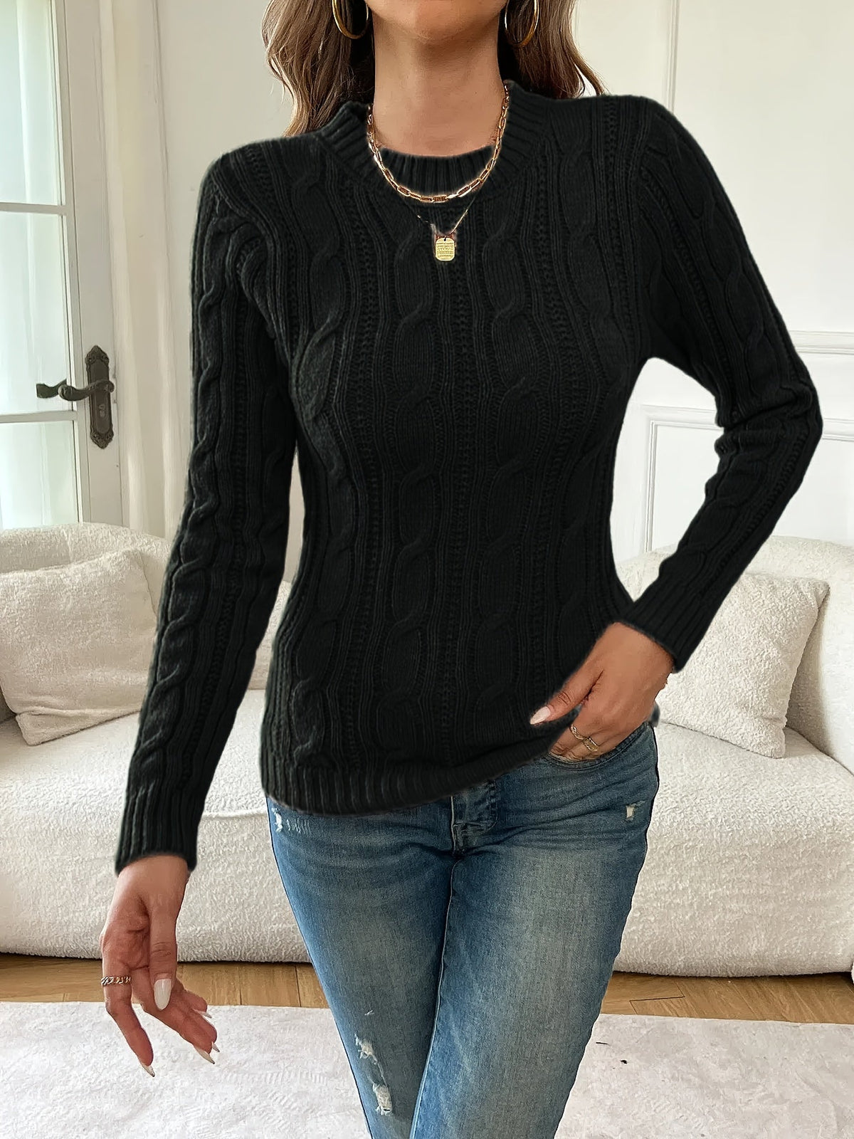 Pull noir torsadé à col rond — Amielle Paris